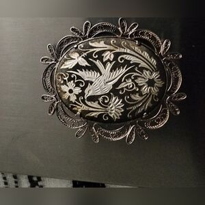 Vintage large oval Damascene bird brooch